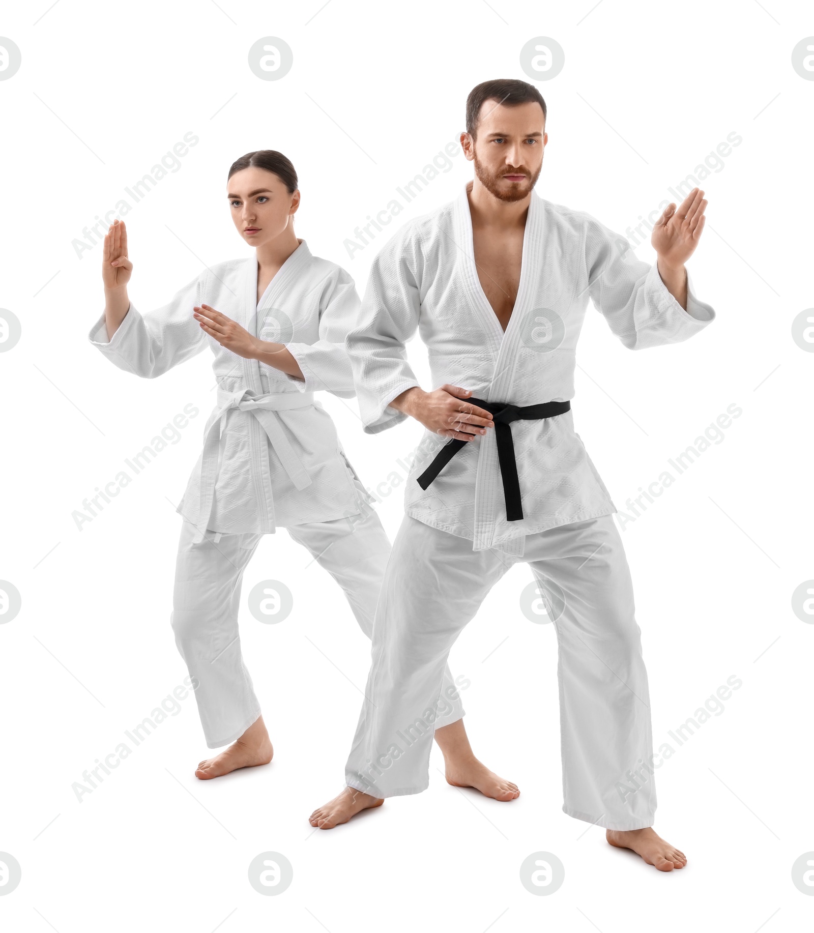 Photo of Karate fighters in uniform on white background