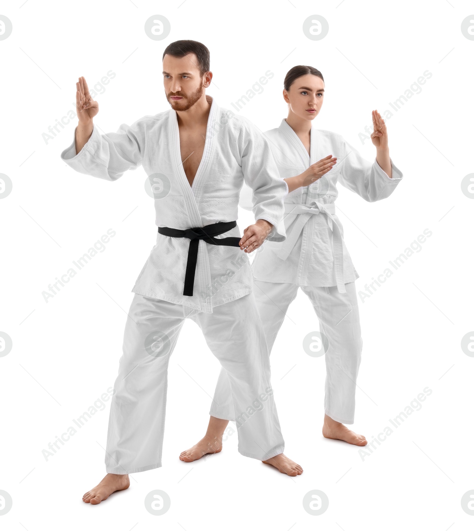 Photo of Karate fighters in uniform on white background