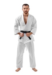 Karate fighter in uniform on white background