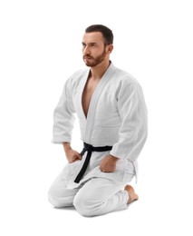 Photo of Karate fighter in uniform on white background