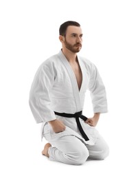 Photo of Karate fighter in uniform on white background