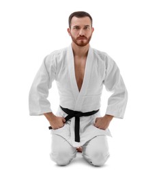 Photo of Karate fighter in uniform on white background