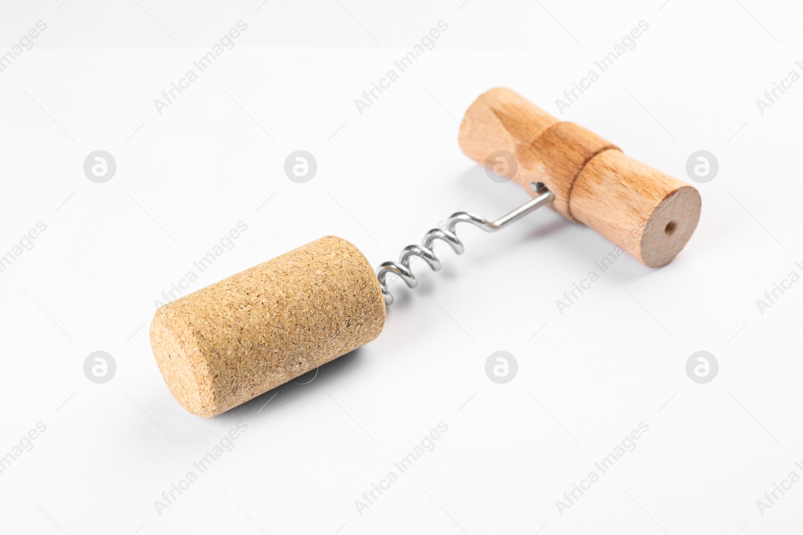 Photo of Corkscrew with wooden handle and cork on white background