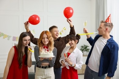 Photo of 21st birthday. Group of happy friends with tasty cake having coming of age party at home