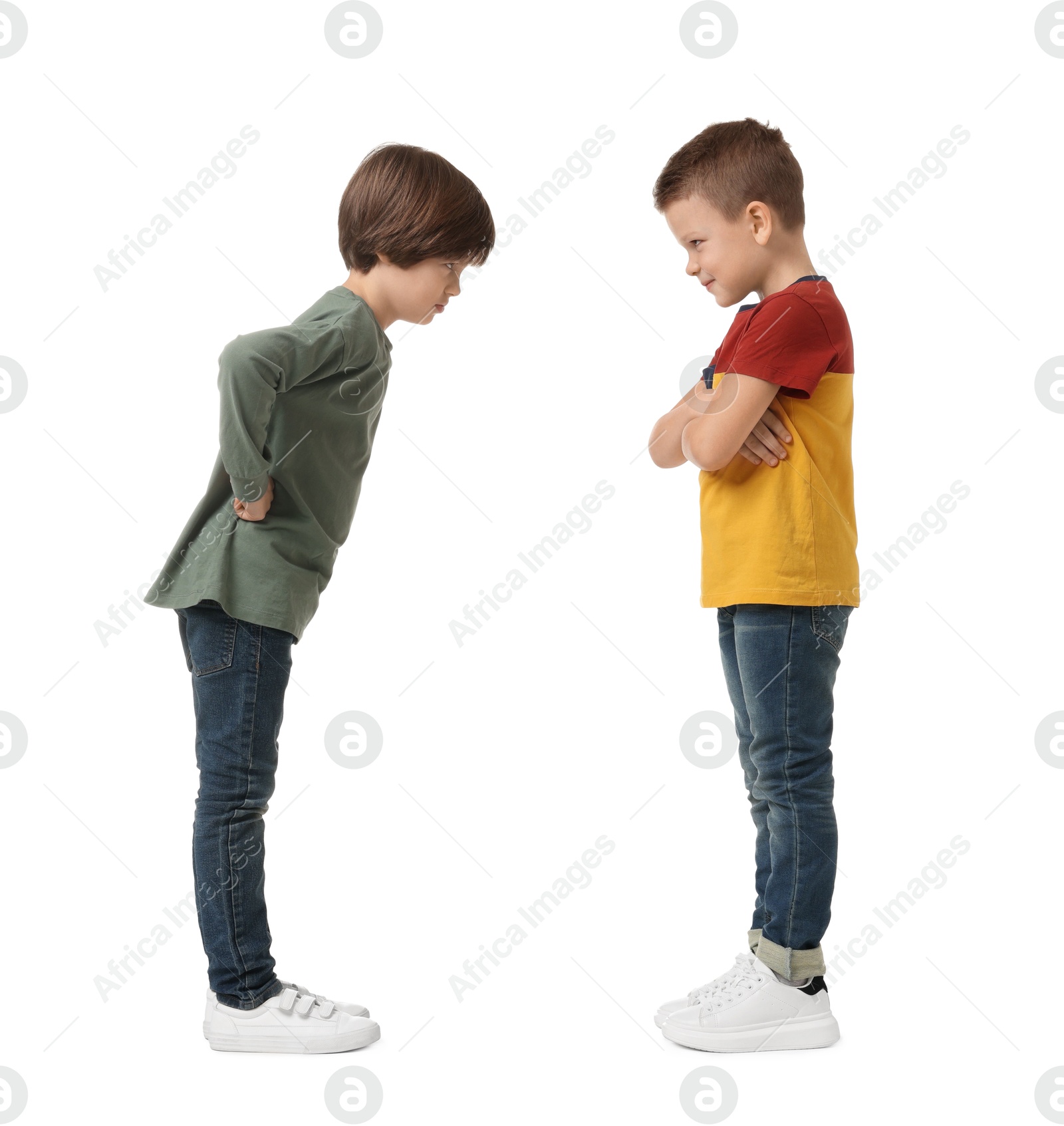 Photo of Angry brothers having argument on white background