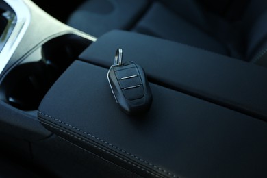 Photo of Car flip key inside of modern automobile, closeup