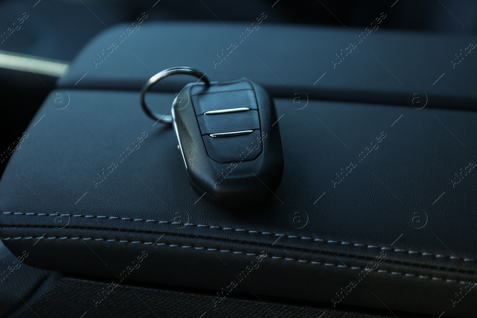 Photo of Car flip key inside of modern automobile, closeup