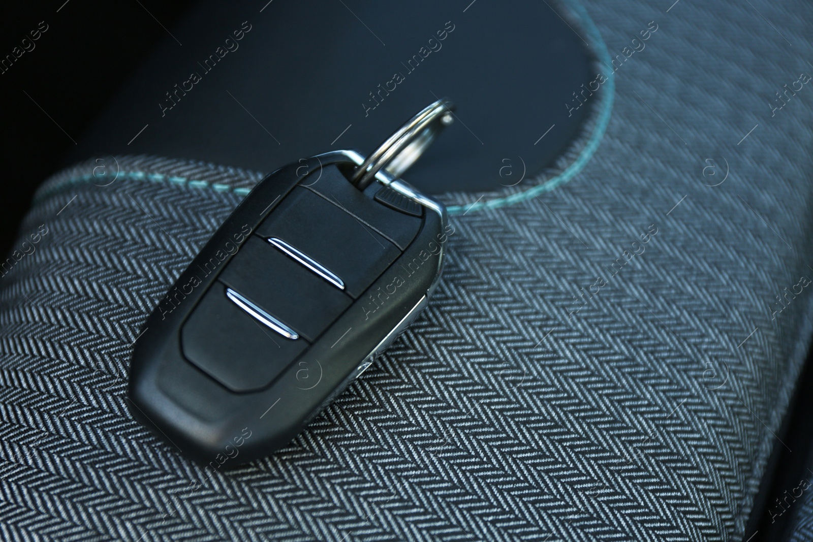 Photo of Car flip key inside of modern automobile, closeup