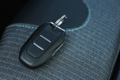 Photo of Car flip key inside of modern automobile, closeup