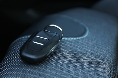 Photo of Car flip key inside of modern automobile, closeup