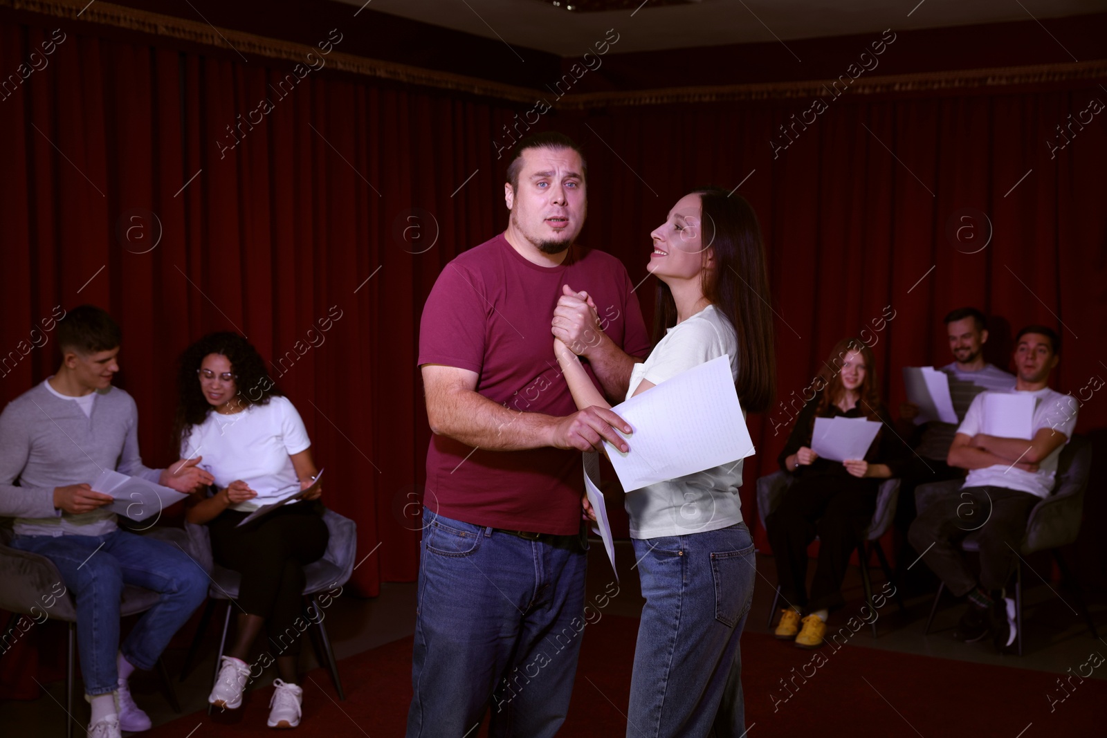 Photo of Professional actors rehearsing on stage in theatre