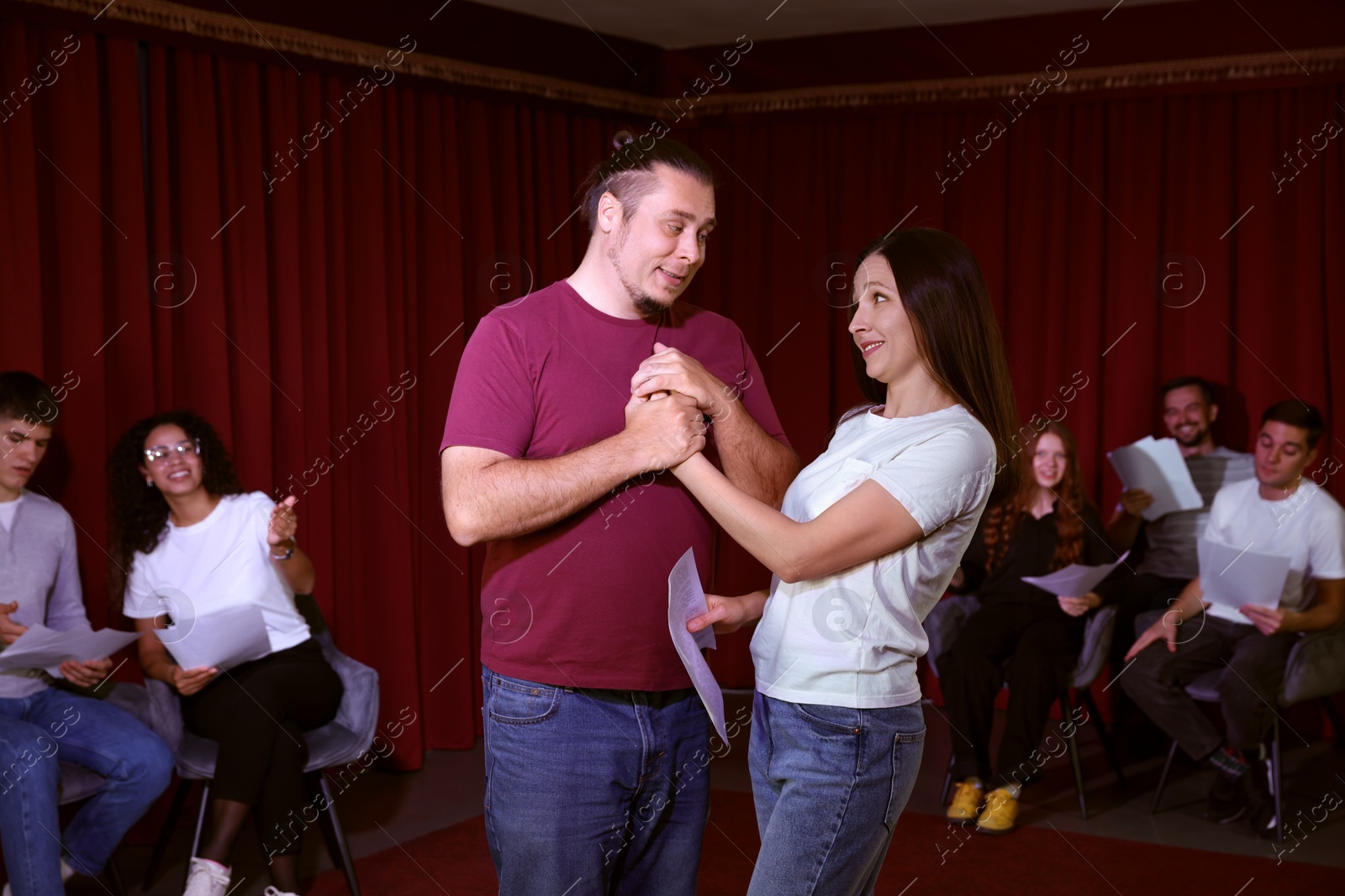 Photo of Professional actors rehearsing on stage in theatre