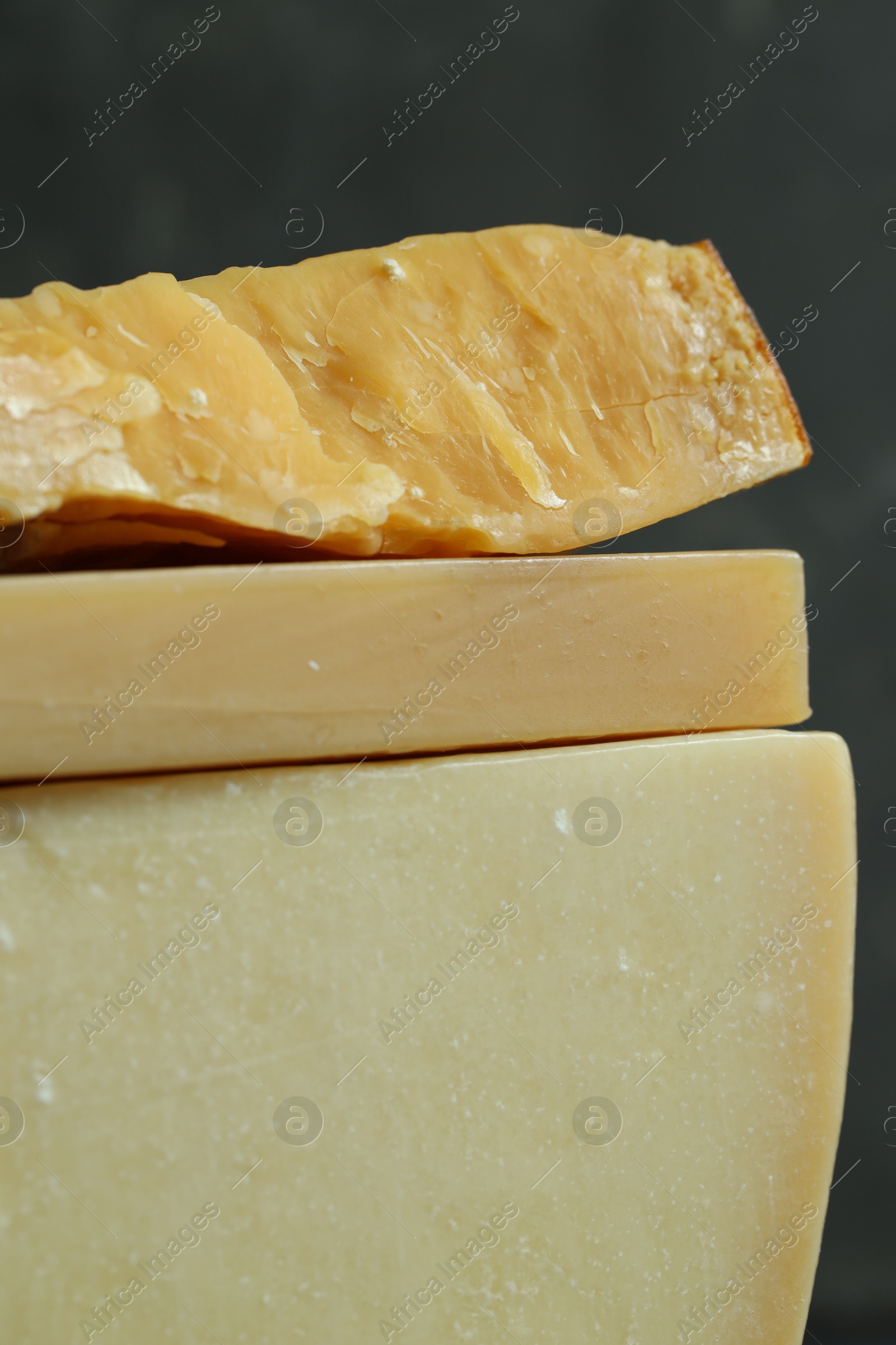 Photo of Different types of cheese on blurred background, closeup