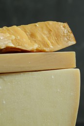 Photo of Different types of cheese on blurred background, closeup