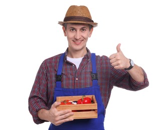 Photo of Farmer with vegetables showing thumbs up on white background