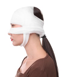 Photo of Woman with nose wrapped in medical bandage after plastic surgery operation on white background