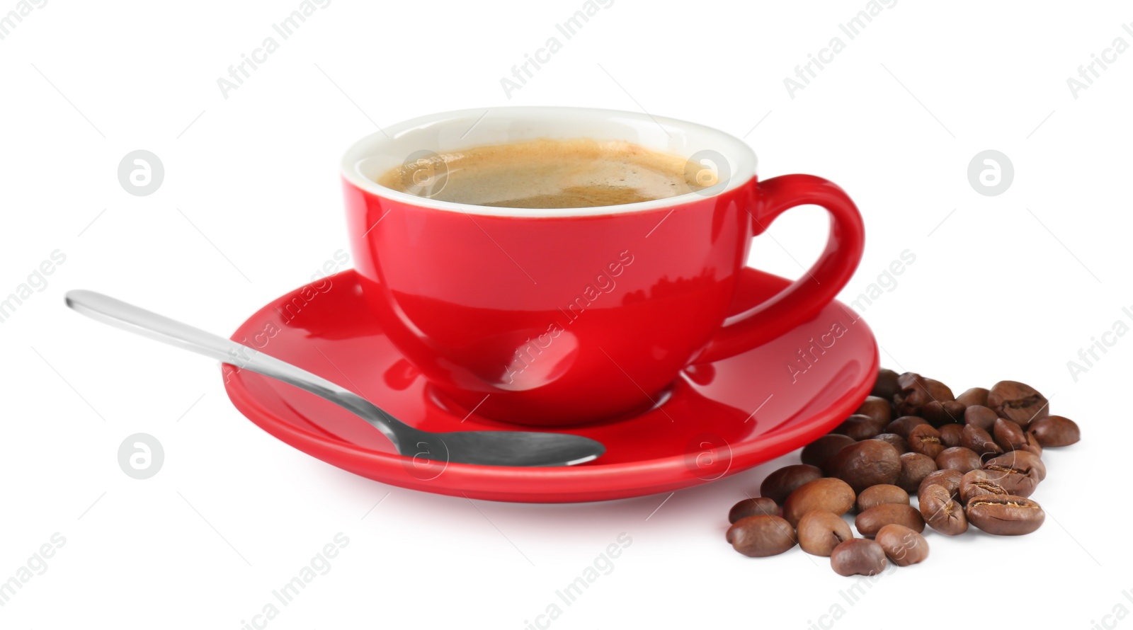 Photo of Red cup of aromatic coffee, saucer, spoon and beans isolated on white