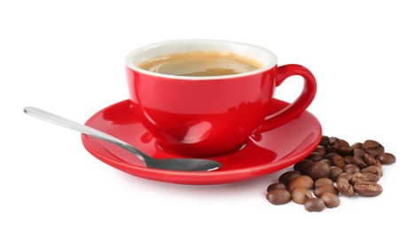 Photo of Red cup of aromatic coffee, saucer, spoon and beans isolated on white