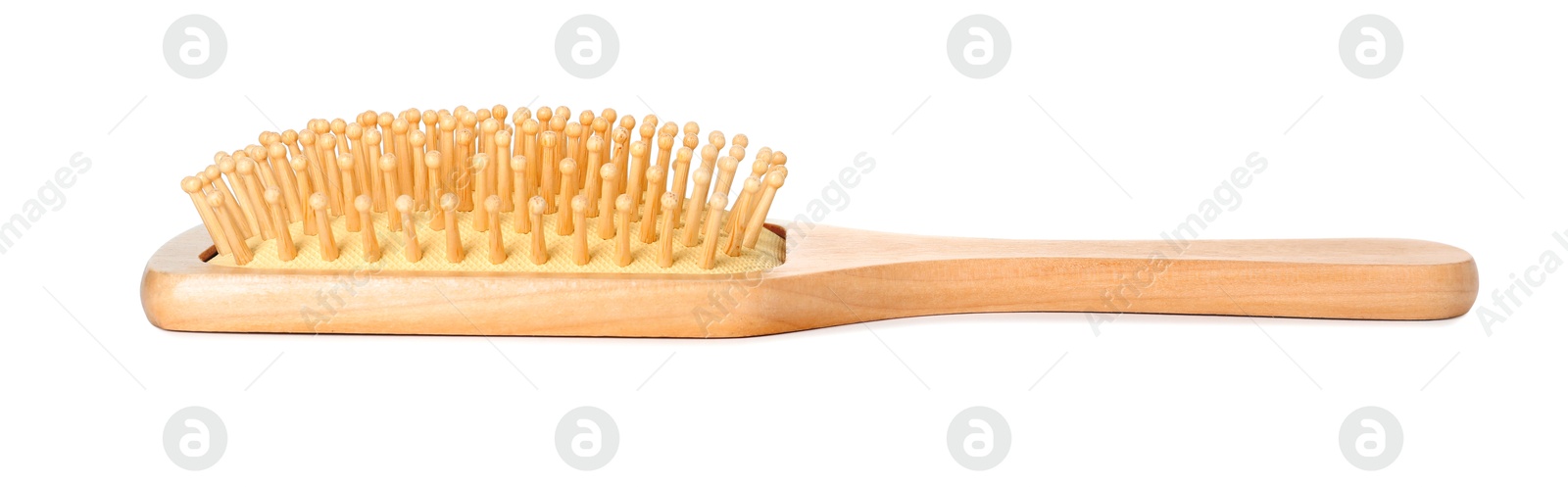 Photo of New wooden hair brush isolated on white