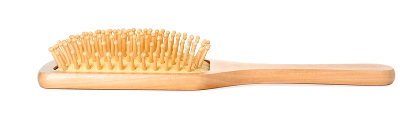 Photo of New wooden hair brush isolated on white