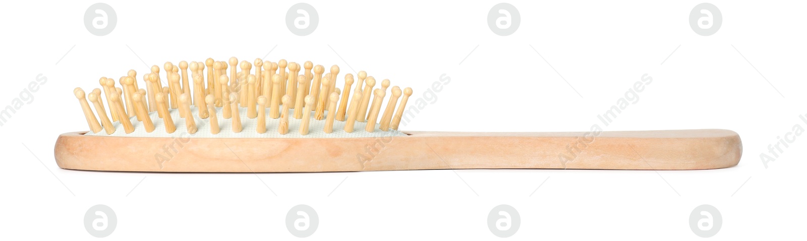 Photo of New wooden hair brush isolated on white