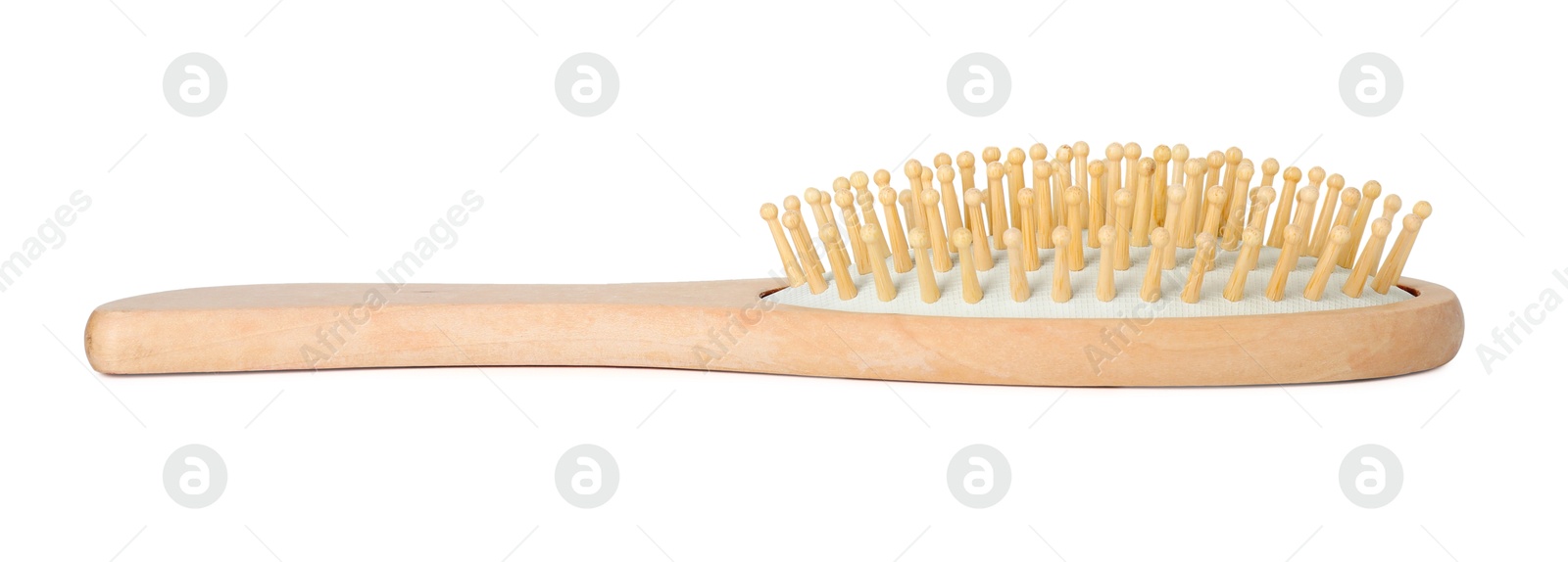 Photo of New wooden hair brush isolated on white