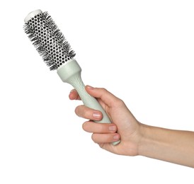 Photo of Woman with round hair brush on white background, closeup