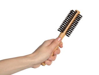 Photo of Woman with round wooden hair brush on white background, closeup