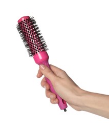 Photo of Woman with round pink hair brush on white background, closeup