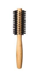 Photo of Hairdresser tool. Round wooden brush isolated on white