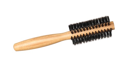 Photo of Hairdresser tool. Round wooden brush isolated on white