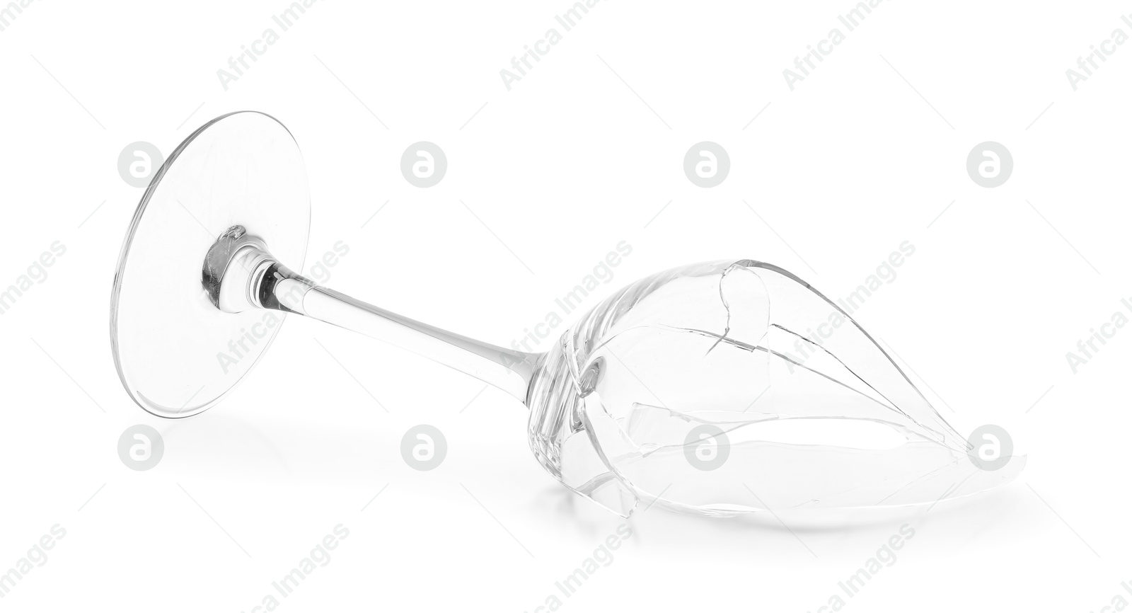 Photo of One broken wine glass isolated on white