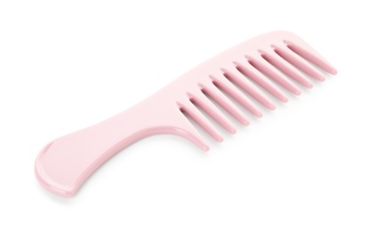 Photo of One pink plastic comb isolated on white