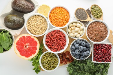 Photo of Superfood. Different healthy food products on white background, flat lay