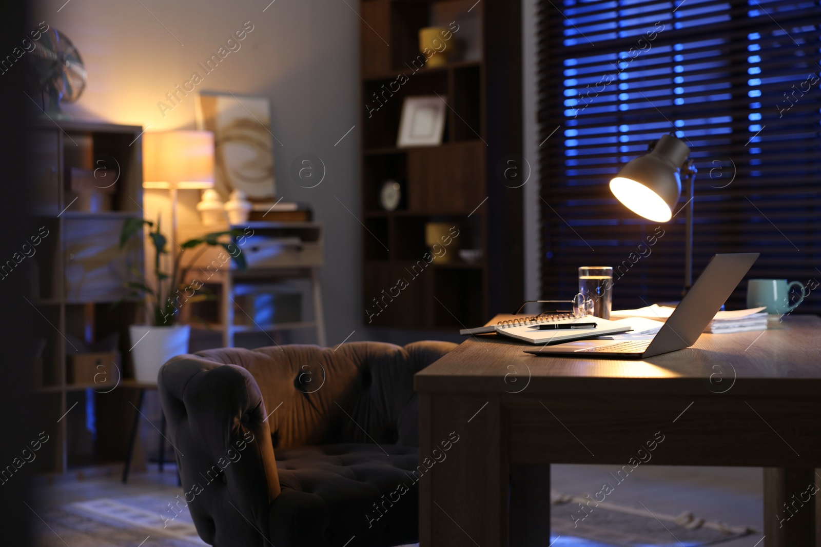 Photo of Workspace with laptop on wooden desk in home office