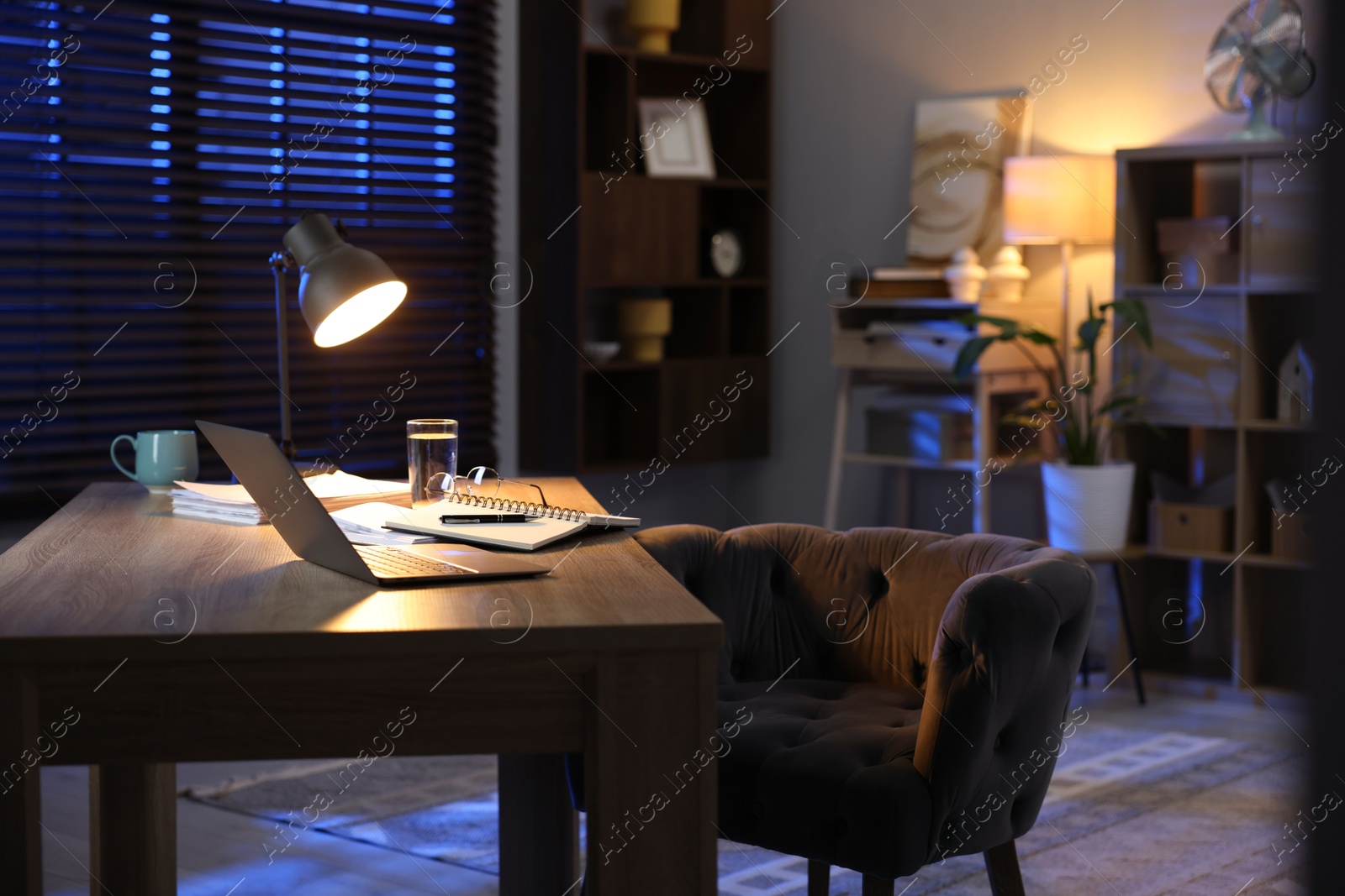 Photo of Workspace with laptop on wooden desk in home office