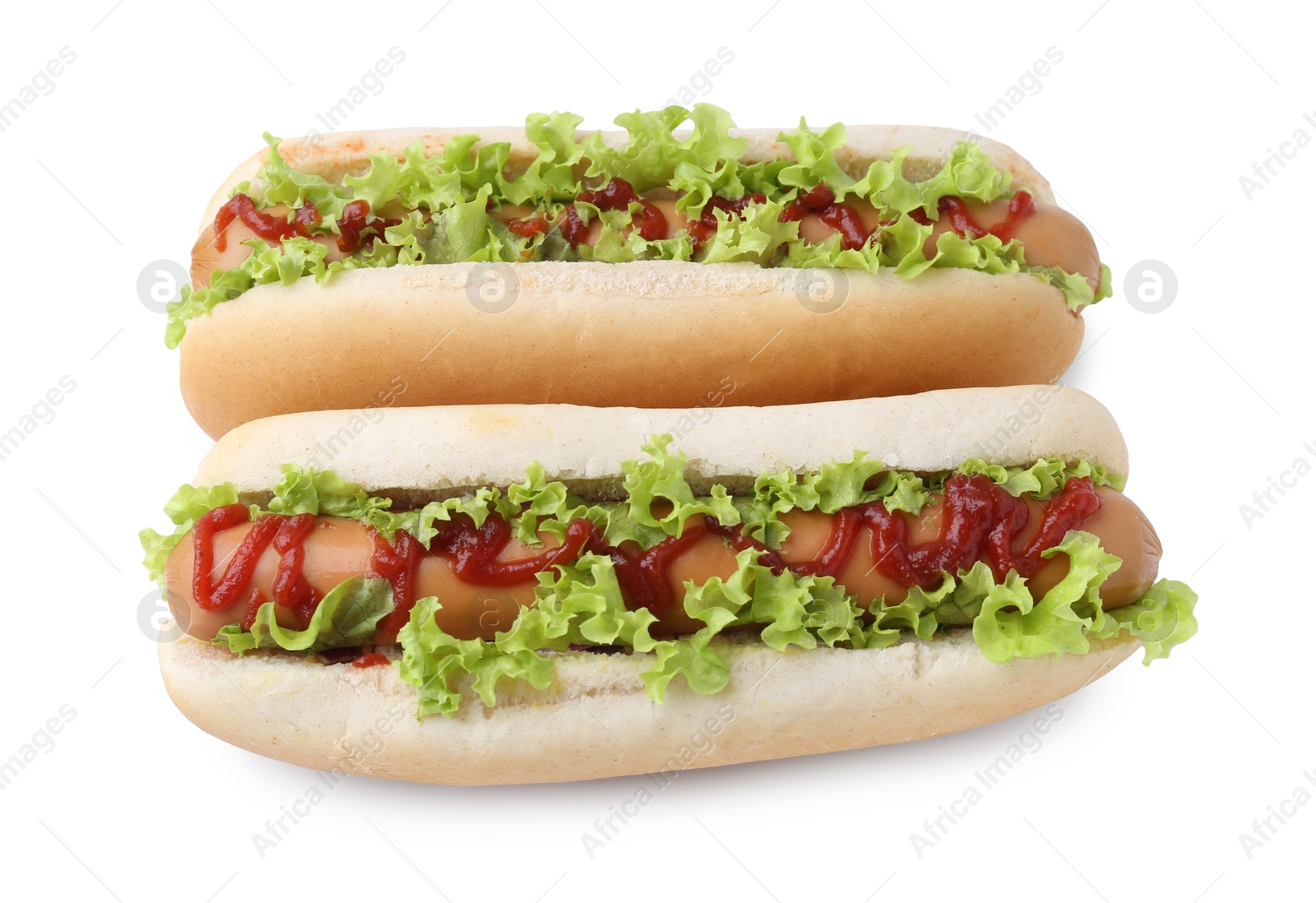 Photo of Tasty hot dogs with lettuce and ketchup isolated on white