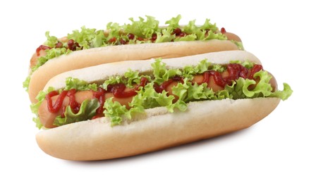 Photo of Tasty hot dogs with lettuce and ketchup isolated on white