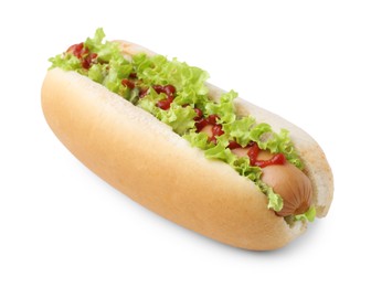 Photo of Tasty hot dog with lettuce and ketchup isolated on white