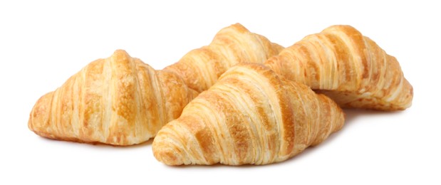 Photo of Tasty fresh croissants isolated on white. Puff pastry