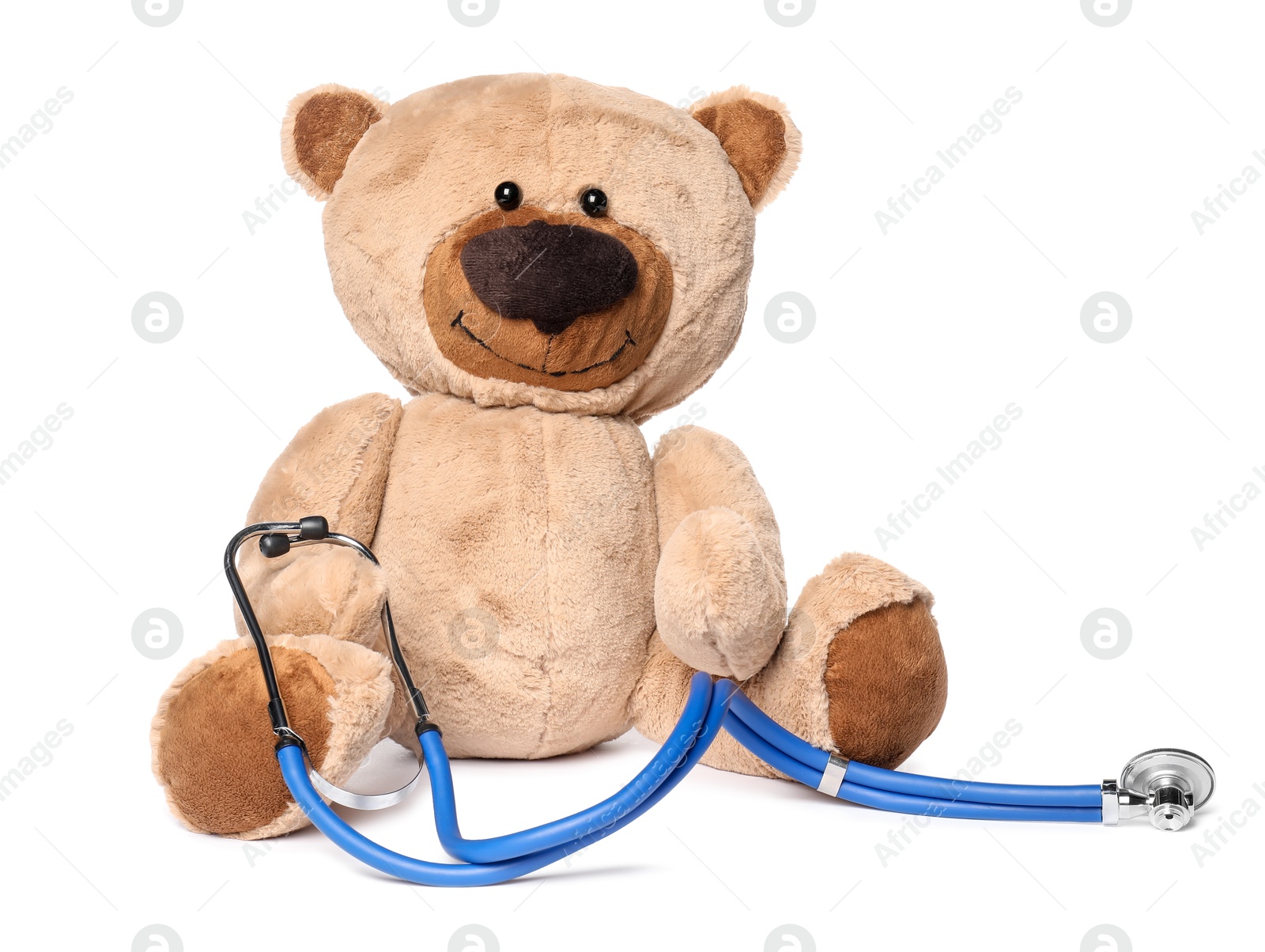 Photo of Pediatrics concept. Teddy bear and stethoscope isolated on white