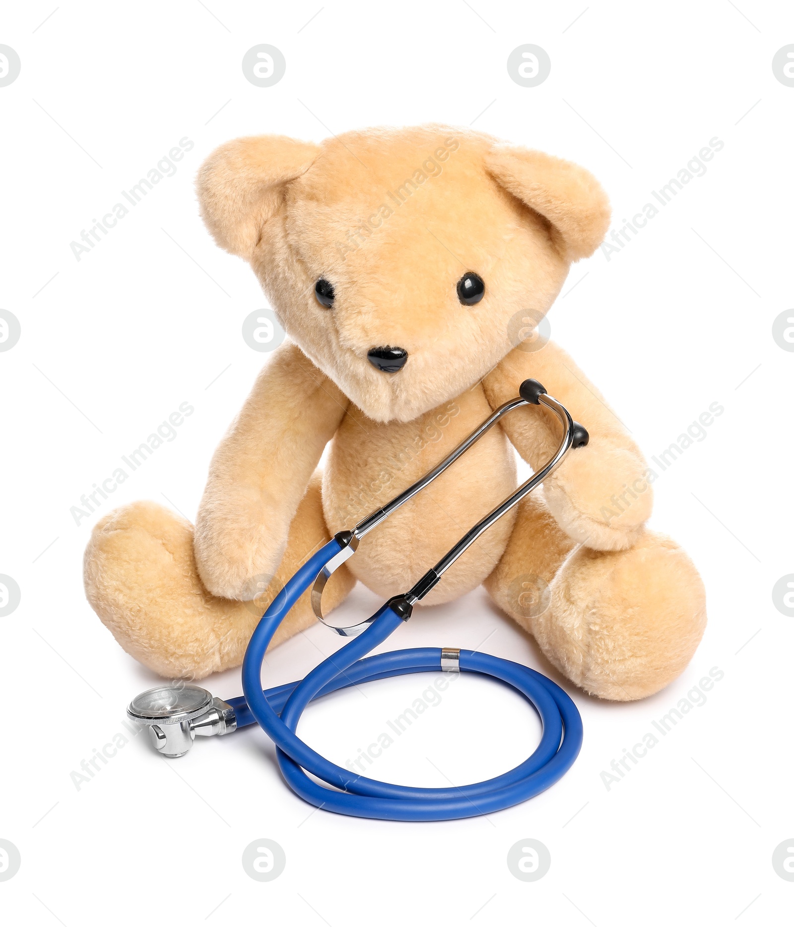 Photo of Pediatrics concept. Teddy bear and stethoscope isolated on white