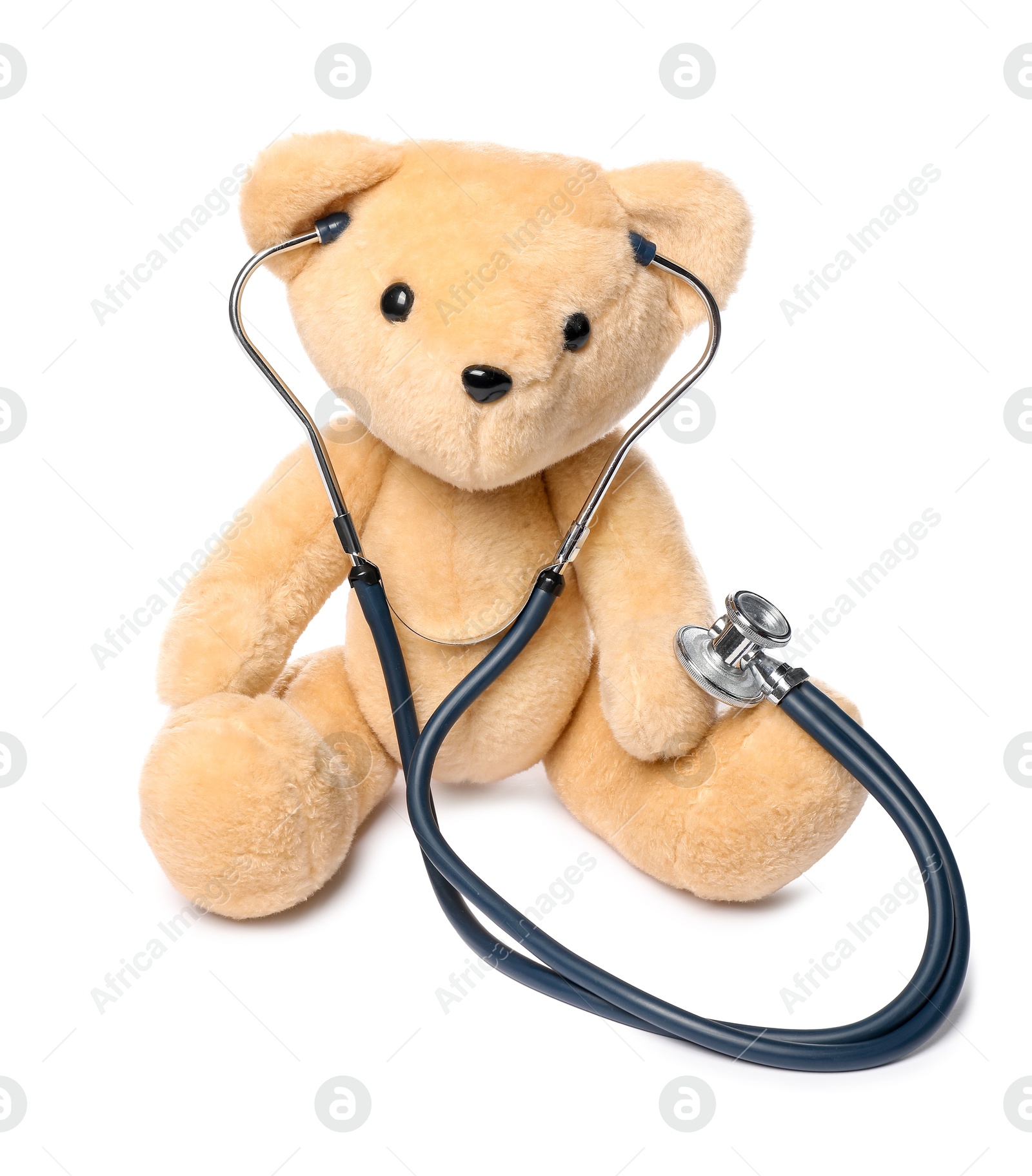 Photo of Pediatrics concept. Teddy bear and stethoscope isolated on white