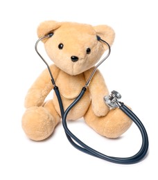 Photo of Pediatrics concept. Teddy bear and stethoscope isolated on white