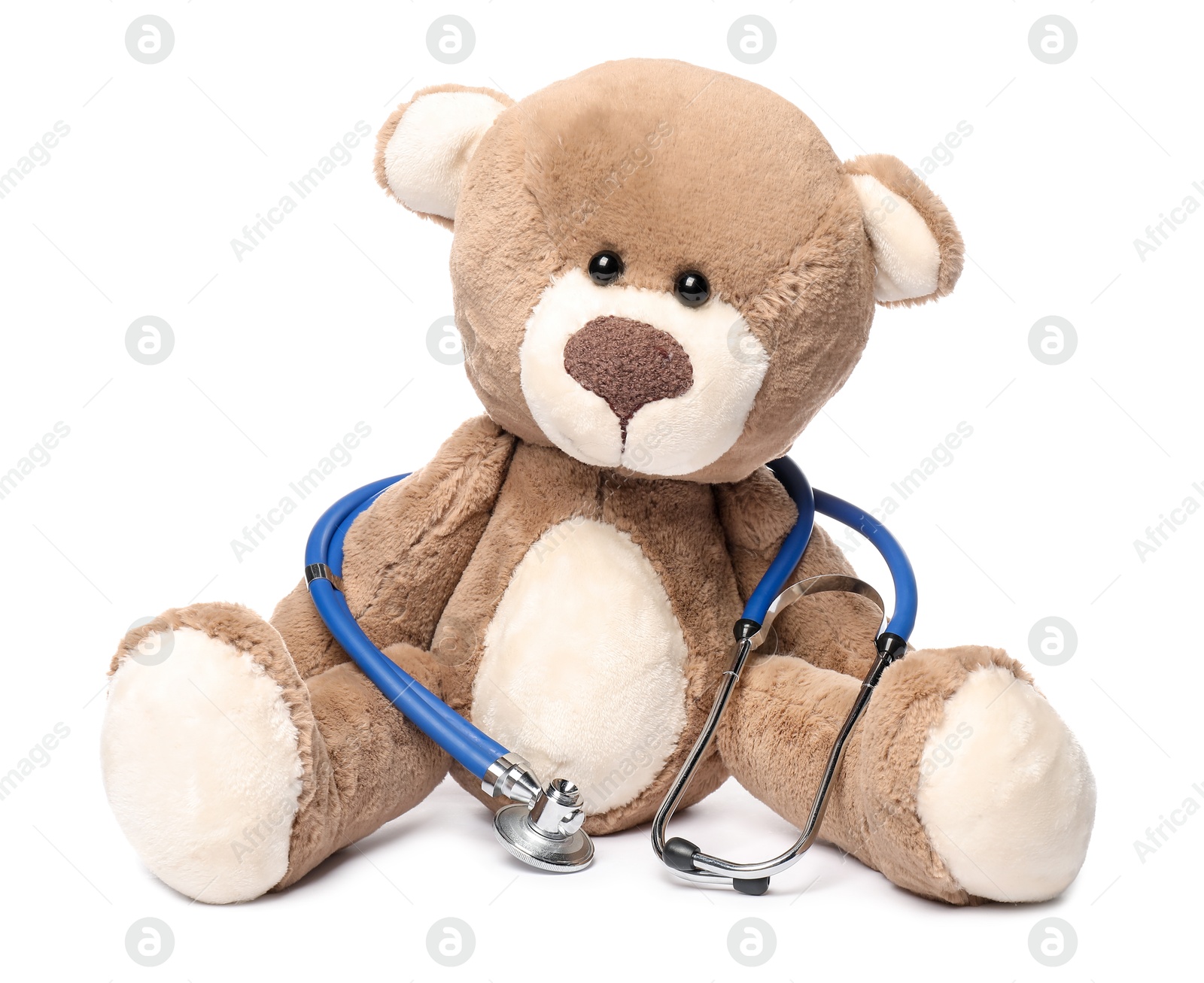 Photo of Pediatrics concept. Teddy bear and stethoscope isolated on white