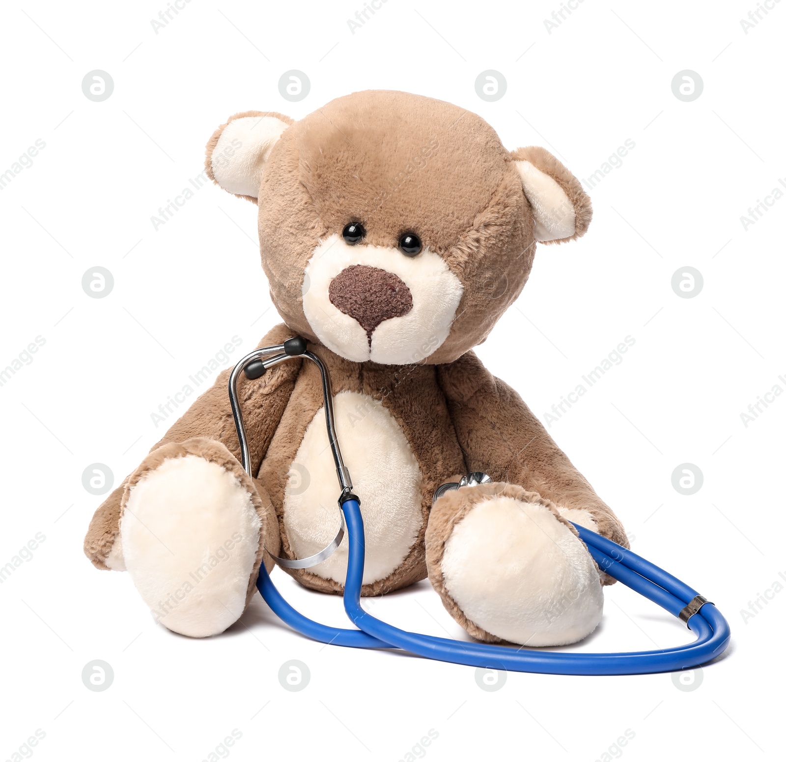 Photo of Pediatrics concept. Teddy bear and stethoscope isolated on white