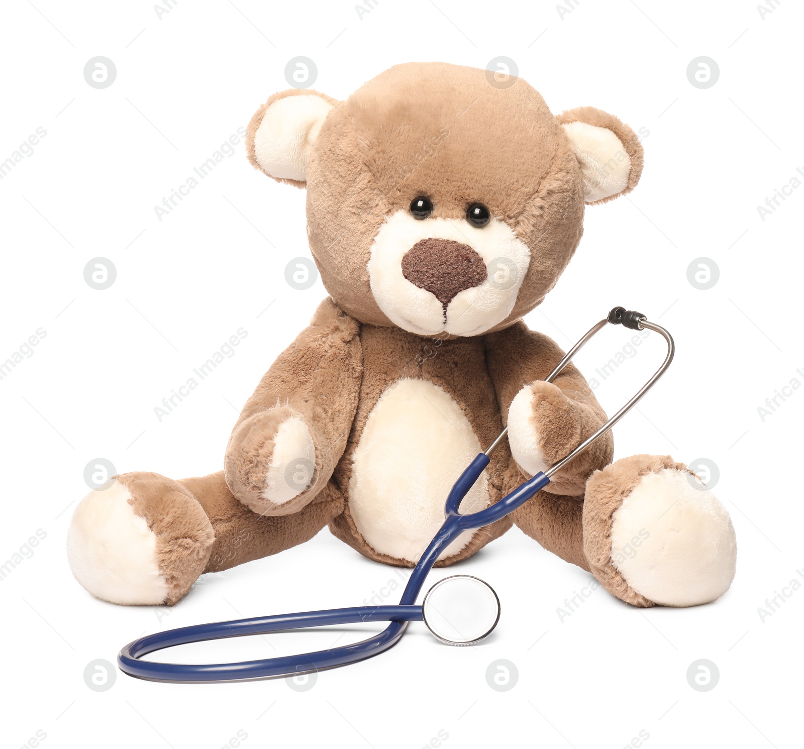 Photo of Pediatrics concept. Teddy bear with stethoscope isolated on white