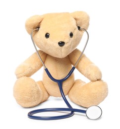 Photo of Pediatrics concept. Teddy bear with stethoscope isolated on white