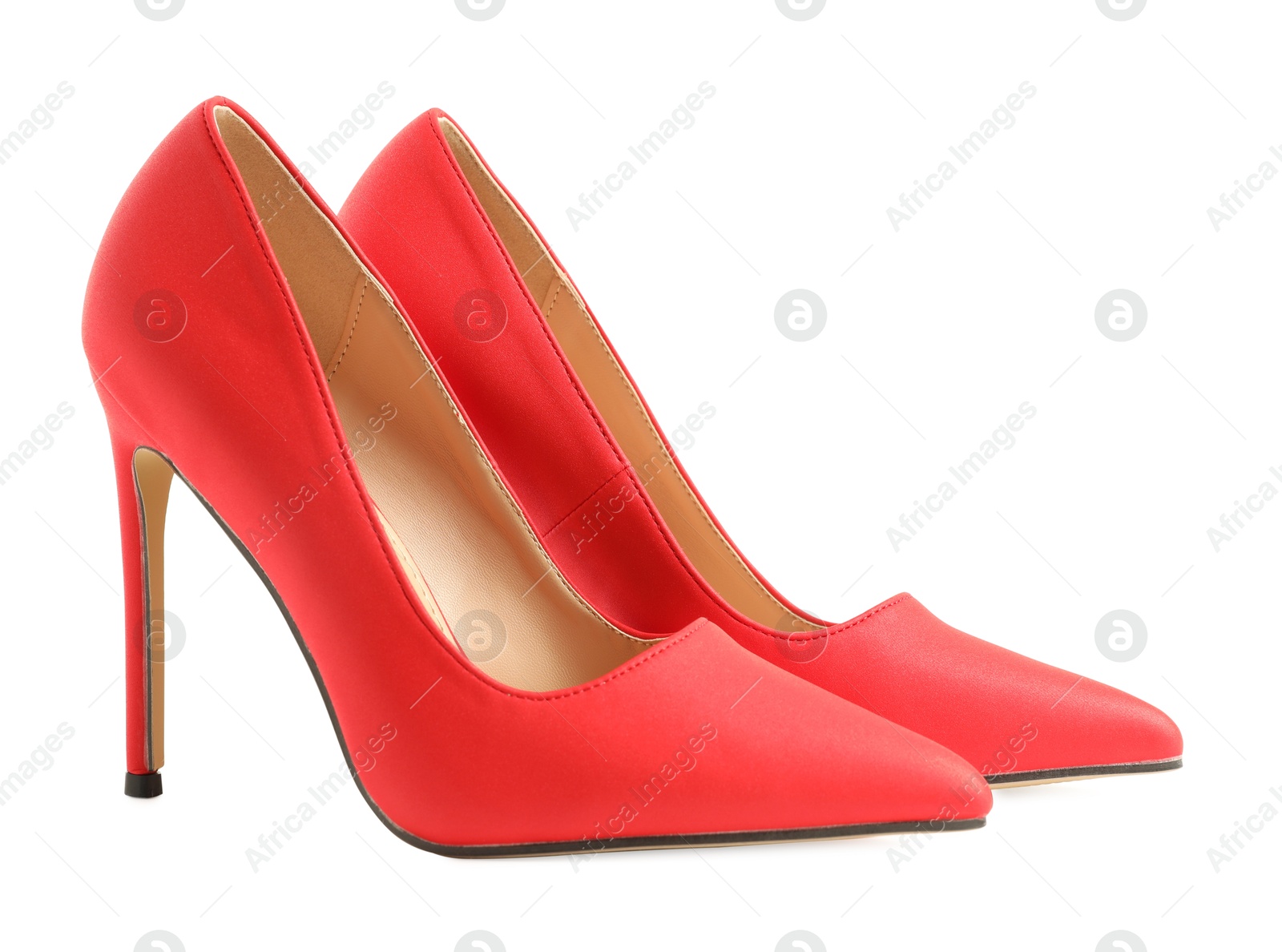 Photo of Pair of stylish red women's shoes isolated on white