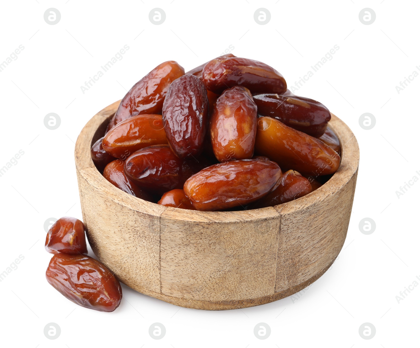 Photo of Tasty dried dates in wooden bowl isolated on white